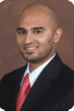 Photo of Dr Sohail Khan in suit and tie